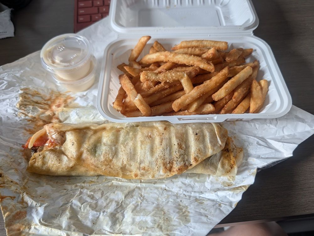 Chicken shawarma wrap with fries and garlic sauce